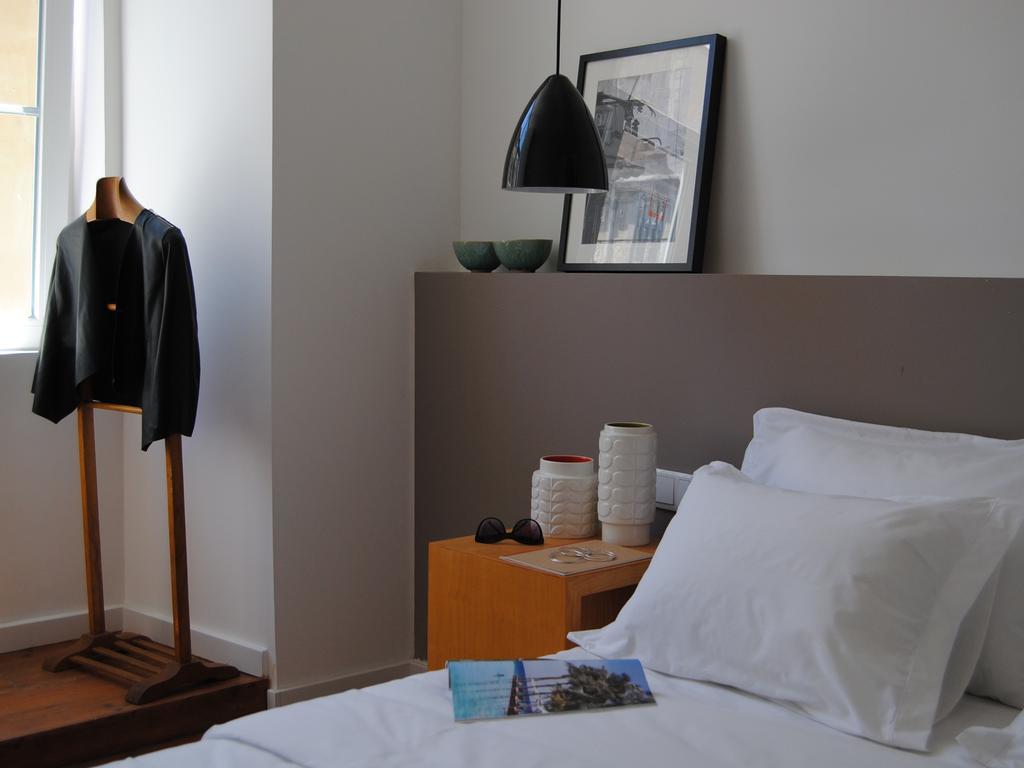 The 8 - Downtown Suites Lisboa Oda fotoğraf A bedroom at the hotel