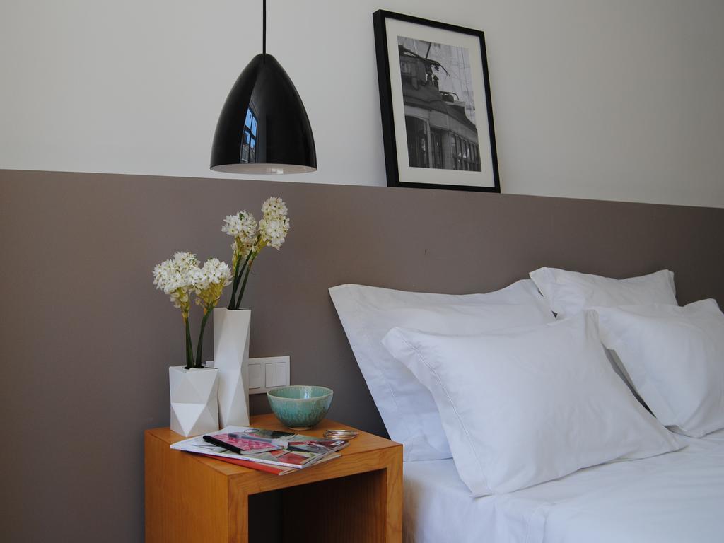 The 8 - Downtown Suites Lisboa Oda fotoğraf A bedroom at the hotel