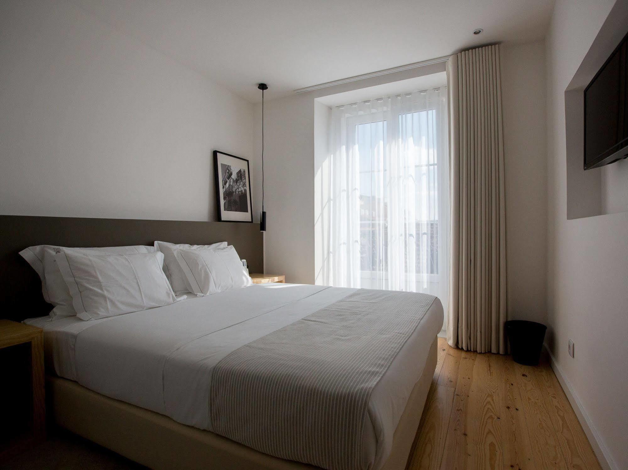 The 8 - Downtown Suites Lisboa Dış mekan fotoğraf A bedroom at the hotel